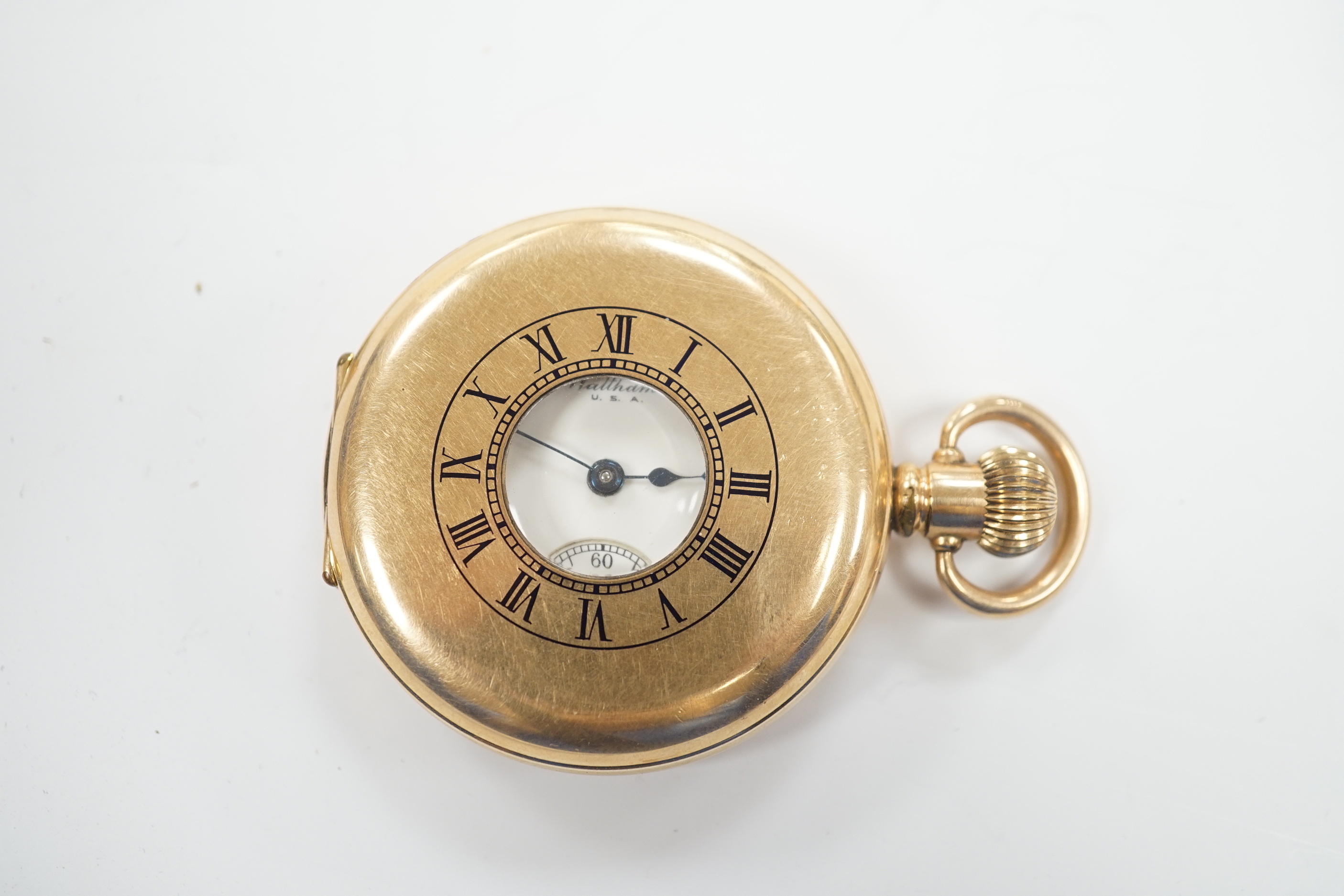 A gold plated Waltham half hunter keyless pocket watch, with Roman dial and subsidiary seconds.